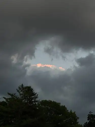 Glimmers of hope peeking through the dramatic storm clouds.